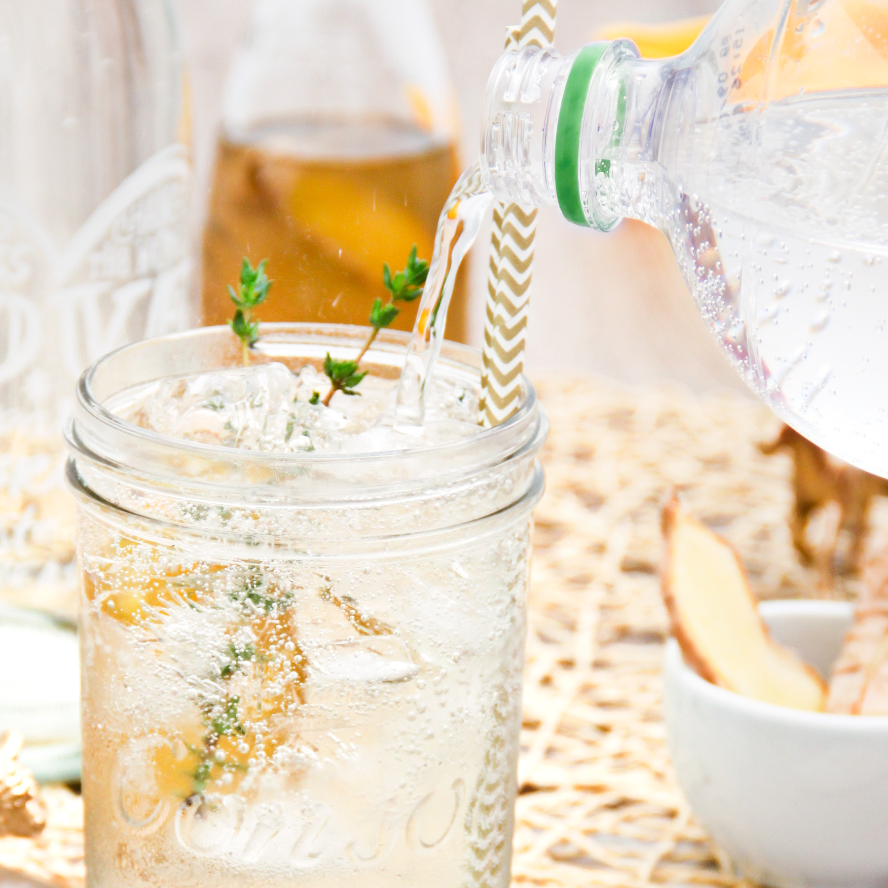 adding soda water to homemade ginger ale syrup recipe