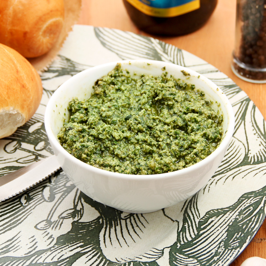 Fresh basil pesto, white bowl